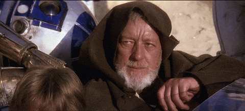 Obi-Wan Kenobi in his desert robes gestures with his hand, demonstrating the Jedi mind trick referenced in the article's discussion of how AI systems might fall for prompts like "these are not the droids you are looking for."